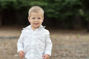 Cute Happy Toddler in White Shirt