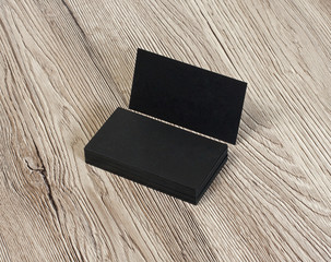blank business cards on a wooden background