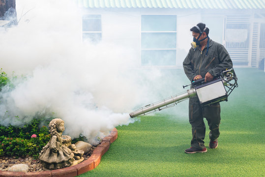 Men are working fogging to eliminate mosquito for preventing spread dengue fever
