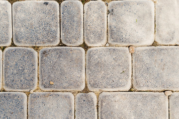 Part of road paved with the cobble stones. Stone background
