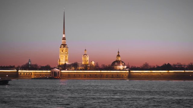 Night. Pleasure boat sails across the Neva River, a view of the river in Saint Petersburg.
