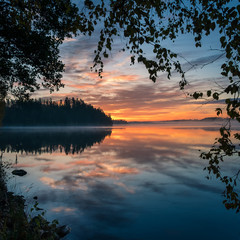 Scenic landscape with lake and beautiful sunrise at morning