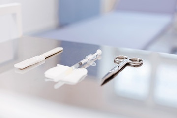 Close up of medical instruments lying on the table