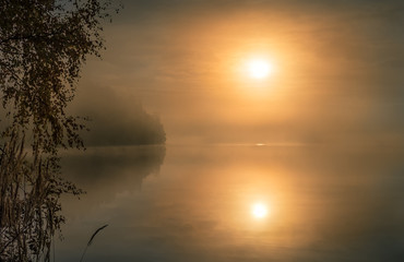 Fototapeta na wymiar Scenic landscape with lake and beautiful sunrise at morning