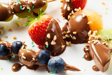 Tasty summer fruit treats dipped in chocolate