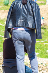 Woman in tight-fitting sports pants on nature