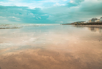 Eastbourne  , East Sussex, England. Eastbourne beach at the low tide on sunset