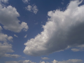 Clear blue sky with white clouds