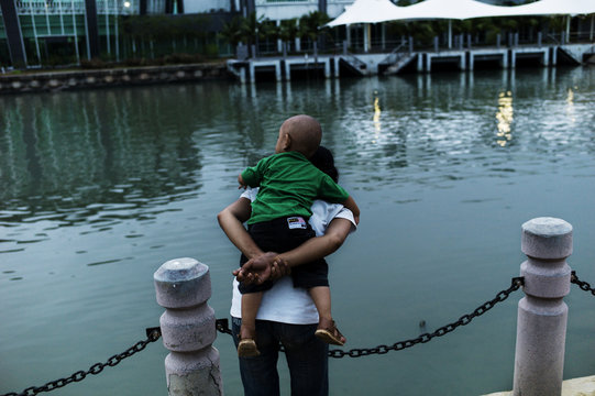 Back View Of Man With Kid