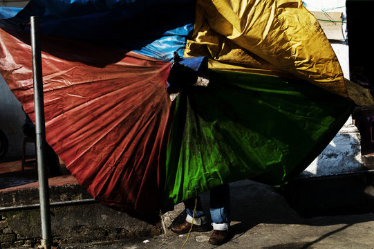Person holding plastic cover
