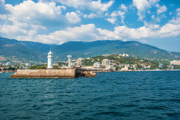 View of the coast of Yalta and a lighthouse from the Black Sea