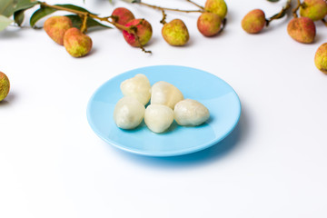 Lychee tropical fruit on a blue plate