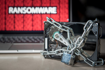Hard disk file locked with monitor show ransomware cyber attack internet security breaches. Malware...