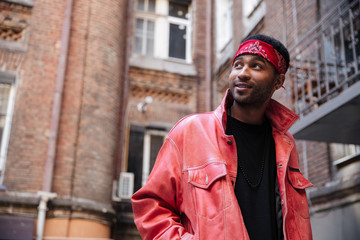 Portrait of a stylish afro american hipster guy wearing headband