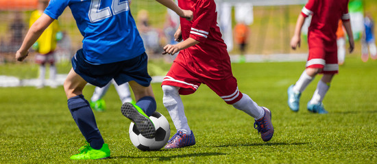 Football Soccer Match for Children. Boys Running and Kicking Football Soccer Ball. Kids Playing Soccer Game Tournament