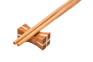 Wooden chopsticks on white backgrounds