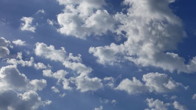 4K. Timelapse rolling clouds. White clouds over blue sky
