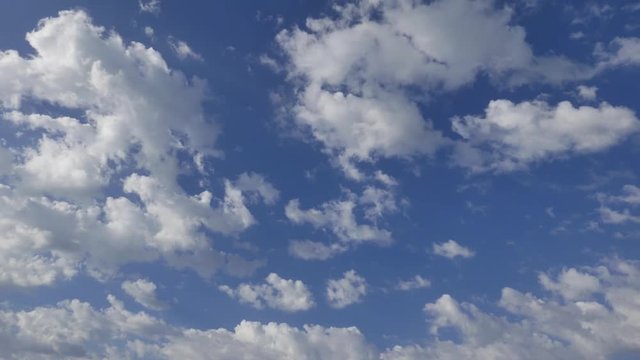 4K. Timelapse rolling clouds. White clouds over blue sky
