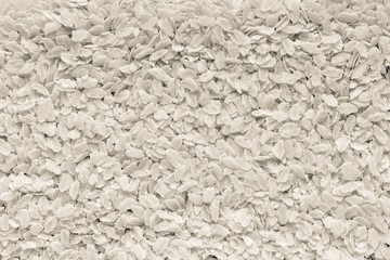 grained textured background of rice flakes