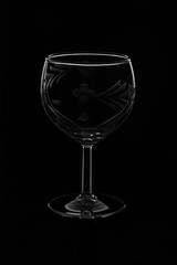 An empty glass of wine, isolate on a black background