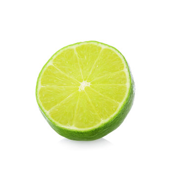 A half of lime citrus fruit with drop isolated on white background