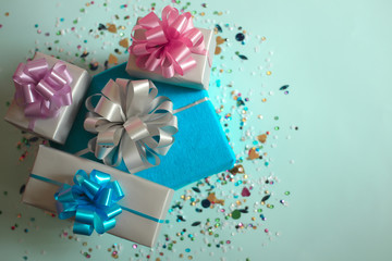 The gift boxes on a blue festive background