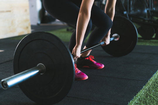 Woman making deadlift exercise