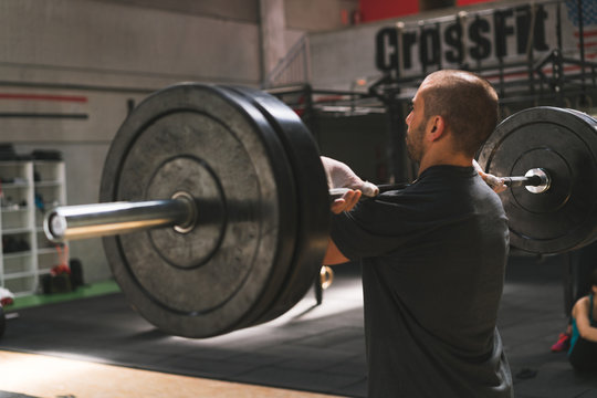 Man lifting barbell