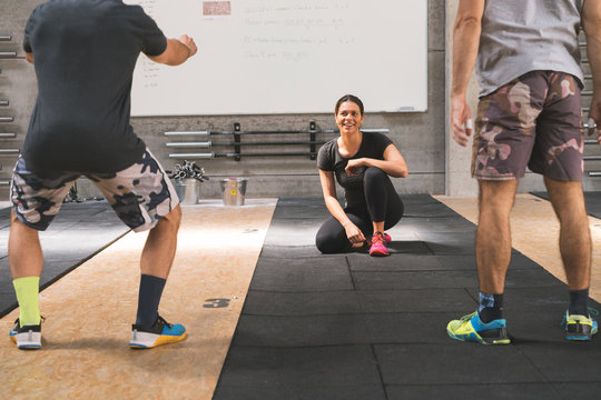 Woman looking at men warming up