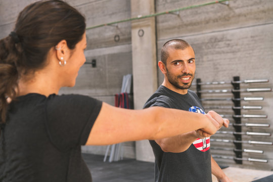 Woman giving fist to instructor