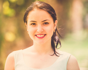Fototapeta premium cheerful smiling young woman portrait in outdoors
