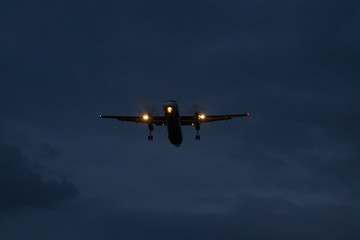 The plane lands at night
