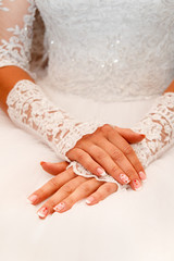 bride hand on white dress