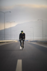 Bicycle rider on the high way