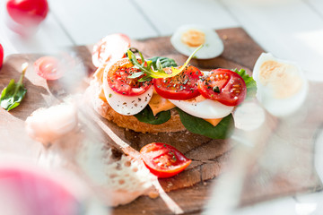 The baguette and cheese on wooden background