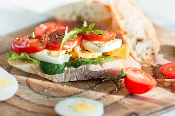 The baguette and cheese on wooden background