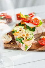 The baguette and cheese on wooden background