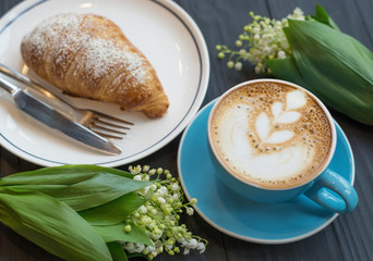Coffee and croissant the rustic background. Concept and idea