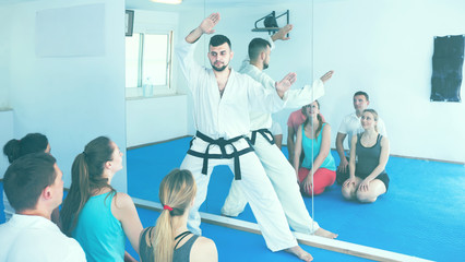 Male karate instructor shows the techniques