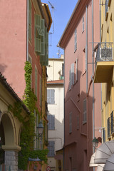Typical alley in the old town of Menton, a commune in the Alpes-Maritimes department in the Provence-Alpes-Côte d'Azur region in southeastern France.