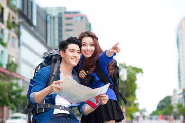 Portrait of an attractive tourist young couple relaxing sightseeing