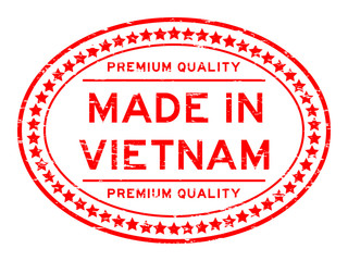Grunge red premium quality made in Vietnam oval rubber seal stamp on white background
