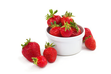 Organic fresh strawberries fruit in white cup isolate on white background