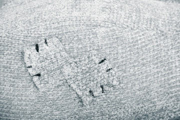 Knitted pattern from woolen warm soft yarn for background. Toned