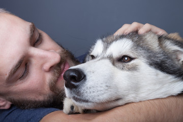 Portrait of a young man with a dog