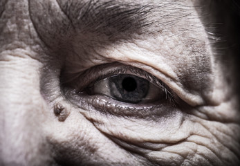 Part of portrait of elderly woman. Eyes. Toned