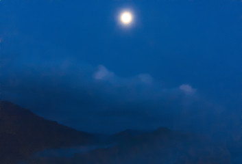 Moonlight at night on mountain, blurred.