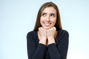 Portrait of a beautiful young woman looking at the camera and smiling