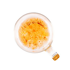 glass of light beer with bubbles in top view