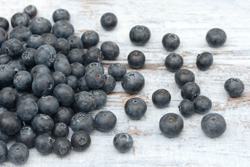 many blueberries lying on wood